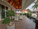 Outdoor living area with seating and greenery