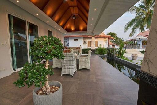 Outdoor living area with seating and greenery