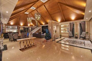 Spacious and luxurious living room with high vaulted wooden ceiling