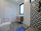 Modern bathroom with geometric tile design and accessible features