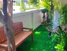 Outdoor garden with wooden bench and lush greenery