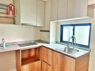 Modern kitchen with wooden cabinets and granite countertops