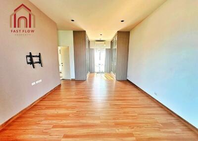 Spacious and modern living room with wooden flooring