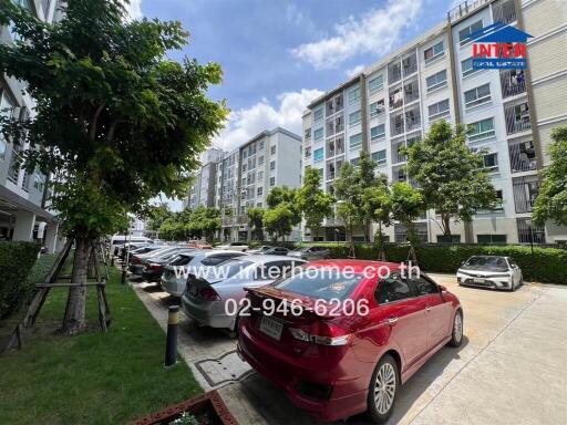 Apartment building exterior with parking area