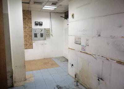 Utility room with exposed wiring and electrical panels