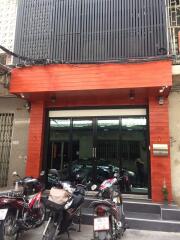 Exterior view of a building with parked motorcycles