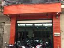 Exterior view of a building with parked motorcycles