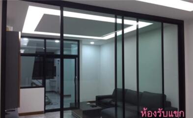 Modern living room with glass partition