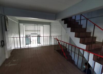 Interior view of a loft area with staircase