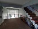 Interior view of a loft area with staircase