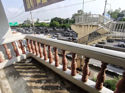 Balcony overlooking a busy road