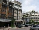 Exterior view of a residential building with parking area