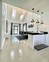 Modern living area with high ceiling and kitchen island