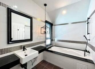 Modern bathroom with black and white decor