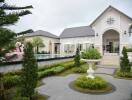 Front view of a residential property with a garden and a pool