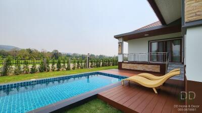 Outdoor pool and deck with loungers