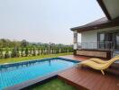 Outdoor pool and deck with loungers