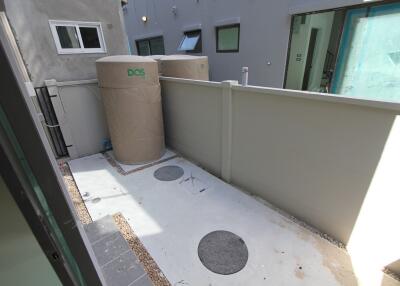 small outdoor section with water tanks