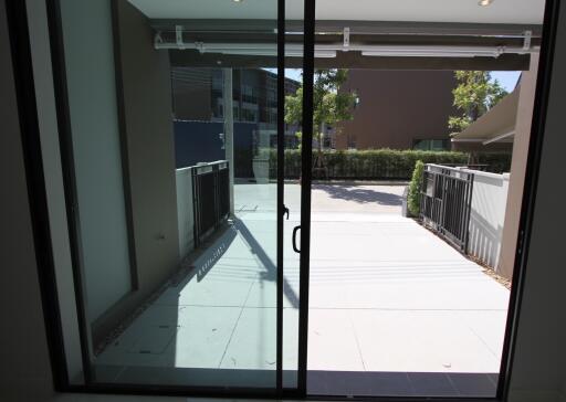 View of the patio from inside through sliding glass doors