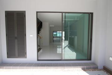 Entrance with glass sliding door and indoor view