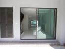 Entrance with glass sliding door and indoor view