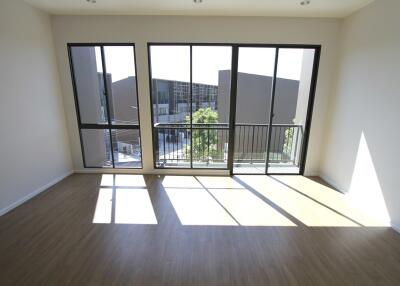 Spacious living room with large windows