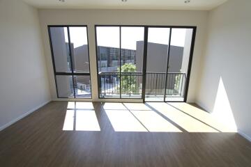 Spacious living room with large windows