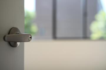 Close-up of a door handle with blurred background