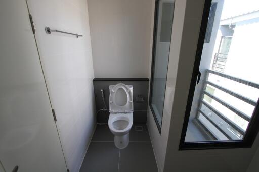 Bathroom with toilet and window