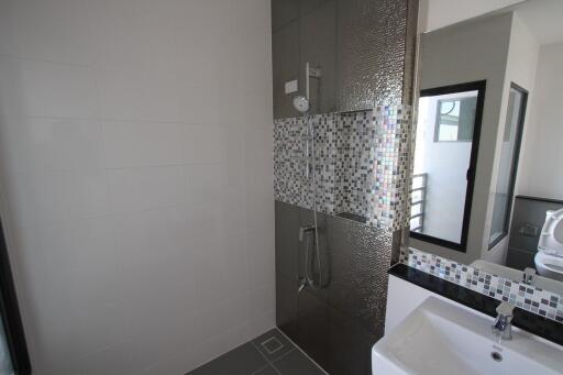 Modern bathroom with a walk-in shower and vanity area