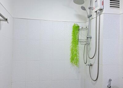 Modern bathroom with shower and white fixtures