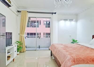 Spacious bedroom with balcony access