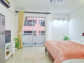 Spacious bedroom with balcony access