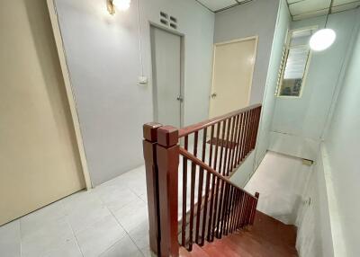 Indoor stairway with doors and hallway