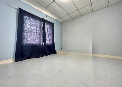 Empty bedroom with window and curtains