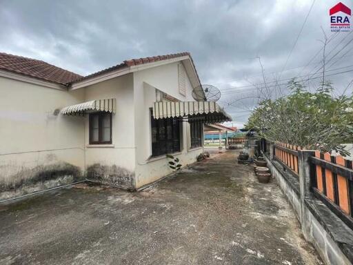 Exterior view of the house with a patio area