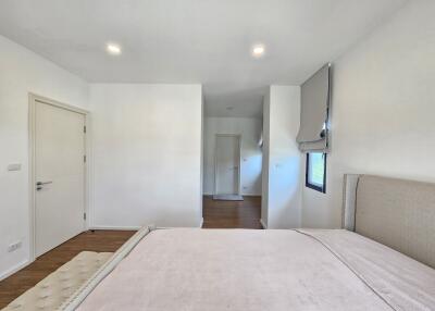 Modern bedroom with minimalist decor and natural light