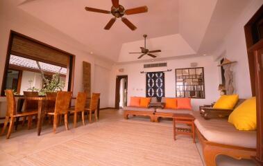 Spacious and well-lit living room with dining area