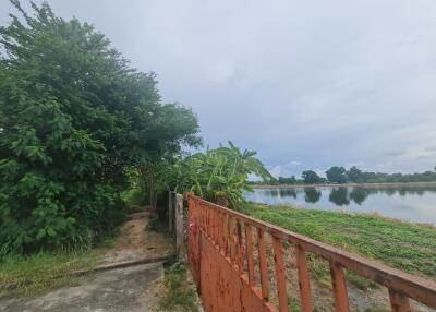 view of the lake with surrounding greenery from the property