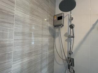 Modern shower with electric shower unit and handheld showerhead