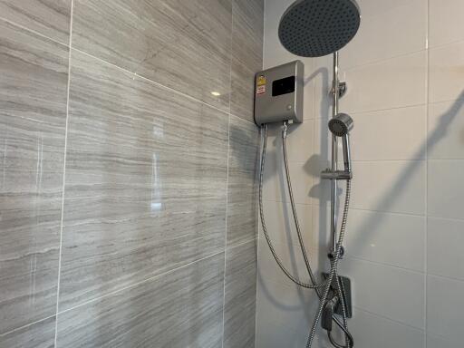 Modern shower with electric shower unit and handheld showerhead