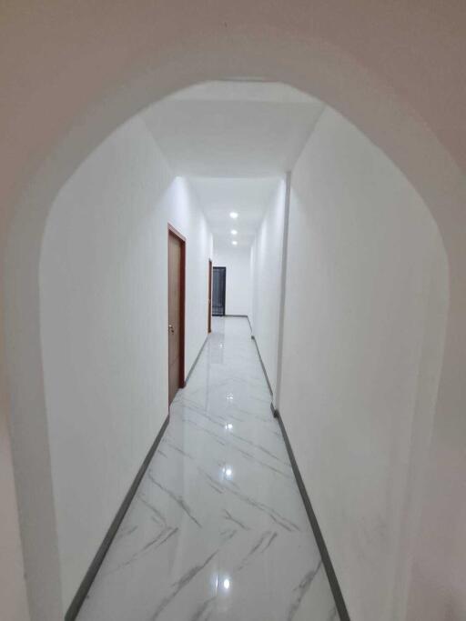 Bright and spacious hallway with marble flooring