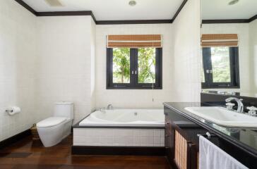 Modern bathroom with large window and bathtub