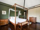 Spacious bedroom with wooden furniture and white bedding