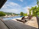 luxurious outdoor pool area with lounge chairs and scenic view