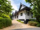 Beautiful house with unique architecture surrounded by greenery