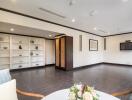 Spacious modern living room with built-in shelves and wall-mounted TV