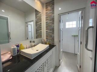 Modern bathroom with large mirror and sink