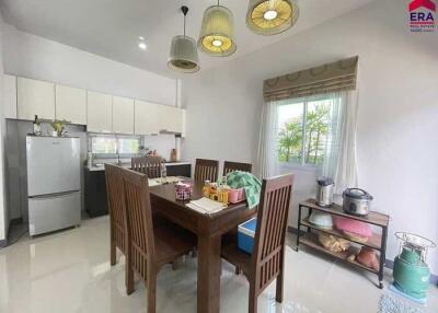 Modern kitchen and dining area with table and chairs