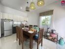 Modern kitchen and dining area with table and chairs